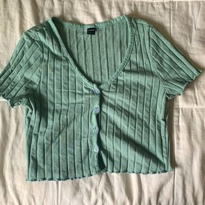 It’s a SHEIN crop top in the color teal-green more sage and it’s a large
